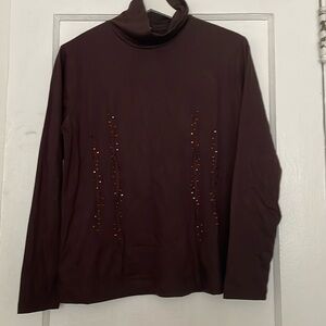 Brown turtleneck with embellishments